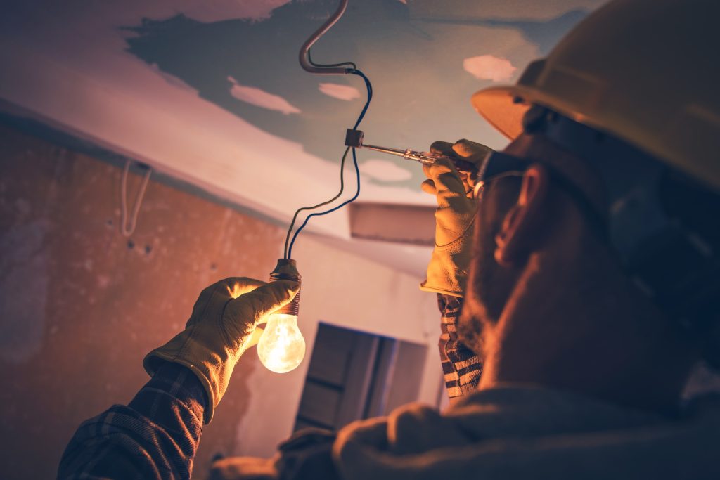 Electrical Contractors Installing Bulb
