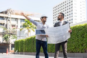 Two Men Holding Electrical Contract